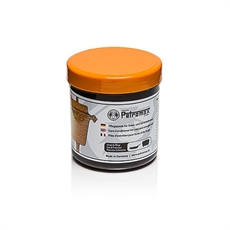 Petromax hoito valuraudalle, 250 ml, oranssilla kannella ja etiketillä. Valmistettu Saksassa.